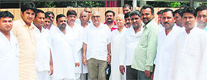 Chief Minister Bhupinder Singh Hooda with 12 Bhiwani municipal councillors after they joined the Congress in Chandigarh on Wednesday