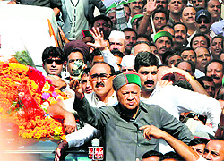 Himachal Congress Committee chief Virbhadra Singh shows a used tear gas shell to mediapersons during a protest rally in Shimla on Wednesday