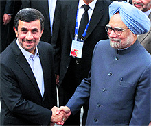 Iranian President Mahmoud Ahmadinejad greets PM Manmohan Singh in Tehran on Wednesday