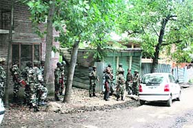 Security personnel at the encounter site in Kulgam