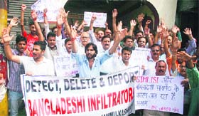 Members of the Rashtriya Jagran Manch stage a protest in Jammu on Wednesday against the atrocities on Bodo tribals in Assam
