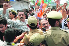 BJYM workers stage protest against the Congress-led UPA government to voice its anger against the alleged fraudulent allotment of coal mines in Jammu on Wednesday