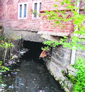 An illegal construction over an irrigation canal in Anantnag