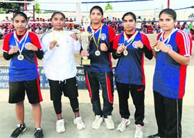 Pugilists of the Sher-e-Punjab Sports Academy strike a pose with their medals in Jagraon
