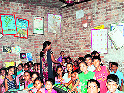 Students study in a dingy classroom