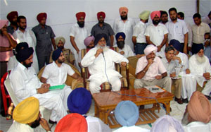 CM Parkash Singh Badal addressing a Sangat Darshan at a village in Lambi constituency on Thursday.