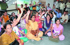 Teachers staging a protest outside the District Administrative Complex in Bathinda on Thursday. 