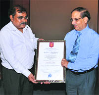 Director, SASE receives the award. 