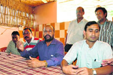 Upendra Thapli (centre), president of the Dehradun Football Association, addresses a press conference in Dehradun on Thursday.