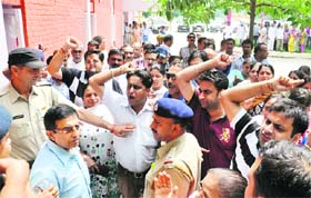 Relatives of Sunanda Kharbanda protest outside the Panchayat Bhavan in Karnal on Thursday