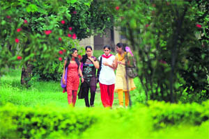 Students enjoy a stroll on the Jammu University campus. 