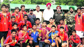 The winning team of the NCC Punjab, Haryana, Himachal Pradesh and Chandigarh directorate poses with the trophy at Punjab Armed Police Astroturf in Jalandhar on Thursday.