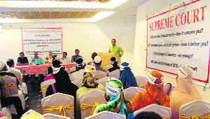 Participants speak during a seminar organised by Association of Parents of Disappeared Persons in Srinagar on Thursday. 