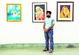 Gurmeet Singh Bajwa displays his paintings at an exhibition in SG Thakar Singh Art Gallery, Amritsar, on Friday.