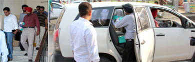 CBI officials take away the records related to the land acquisition for the Mandi Khurd sanitary landfill facility from the office of the Municipal Corporation Bathinda on Friday.