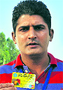Lalit Kumar shows his ATM card.