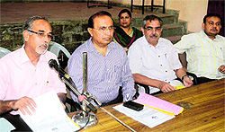 Dr Devendra Bhasin (second from left), Principal, DAV (PG) College, at a press conference in Dehradun on Friday