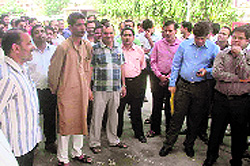 Employees of the power corporation stage a demonstration in Dehradun on Friday