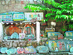 Writings and carvings in Tibetan and Bhoti languages on rocks in the McLeodganj area of Dharamsala.