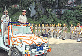 Director-General of Police DS Manhas takes a round in a jeep during his superannuation ceremony at Bharari in Shimla on Friday.
