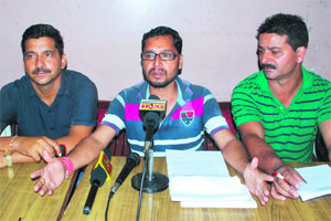 Members of the daily wage workers of the Power Development Department at a press conference in Jammu on Friday. 