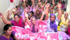 CPM workers protest against price rise in Jalandhar on Friday.
