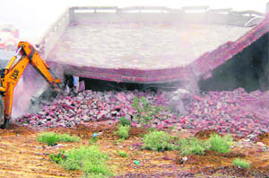 An unauthorised shop being razed during a demolition drive carried out by the authorities at Fatehabad