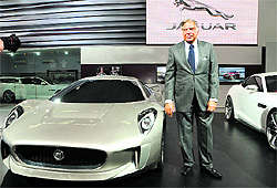 Ratan Tata poses with the iconic Jaguar sports car. Tata Motors is examining the possibility of building a plant in Saudi Arabia to assemble Jaguar Land Rover cars next to a new aluminium smelter