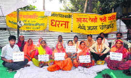 Shopkeepers stage a protest at Mauli Jagran in Chandigarh on Saturday. 