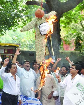 Muslim activists from a social welfare group burn an effigy of Ajmal Kasab during a protest demanding an early execution of the terrorist who carried out the 2008 Mumbai attack, in New Delhi on Saturday
