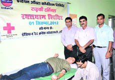 Volunteers and members of the Indian Red Cross Society donate blood at a blood donation camp at Landaura, Roorkee, in Haridwar on Saturday.
