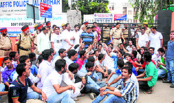 BJP workers hold a dharna outside the office of ADCP (traffic) in Jalandhar on Saturday