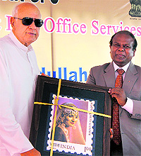 Union Minister Farooq Abdullah releases a postal ticket at the GPO in Srinagar on Saturday
