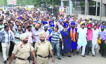 Members of auto unions go to the office of the Police Commissioner to submit a memorandum to him in Ludhiana on Saturday. 