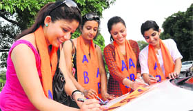 ABVP supporters make posters on the PU campus on Sunday.