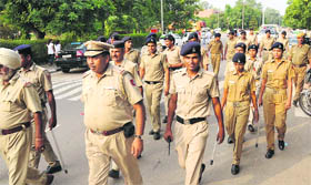 Chandigarh police officials take a round of the Panjab University campus during the student election campaign on Sunday.