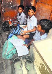 Students sit in a dingy classroom at Government Primary School, Mauli Jagran.