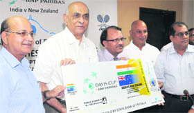 Rajan Kashyap (second from left) gives the first ticket to Gurnam Singh (third from left) in Chandigarh.