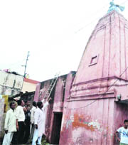 The rooftop of the Sant Ravidas temple got damaged due to lightning at Jwalapur in Haridwar on Sunday.