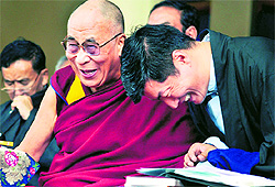 The Dalai Lama shares a light moment with Tibetan Prime Minister-in-exile Lobsang Sangay at the 52nd Tibetan Democracy Day function at McLeodganj in Dharamsala on Sunday