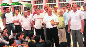 Kurukshetra NIT officiating director VK Arora persuades students to end their strike on Sunday. 
