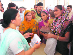 Haryana Education Minister Geeta Bhukkal listens to public grievances in Jhajjar on Sunday.
