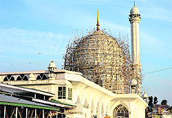 Renovation work being done on the dome of the Hazratbal shrine in Srinagar
