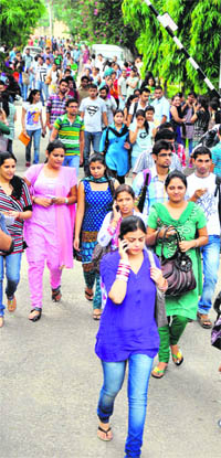 Students after taking the entrance exam for JK Bank at the Government Women College, Gandhi Nagar, in Jammu on Sunday. 