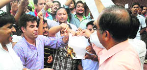 The youth wing of the Panun Kashmir stage a protest against the J-K ex-interlocuters report  in Jammu on Sunday.  