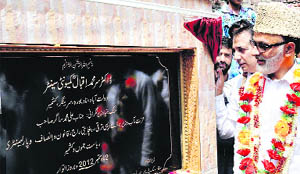  Minister for Rural Development AM Sagar lays the foundation stone of a community centre at Khanyar in Srinagar. 
