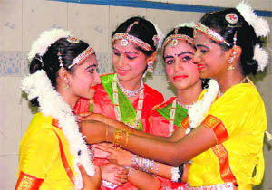 Girls get ready to perform a dance during Onam celebrations at Kidwai Nagar in Ludhiana.