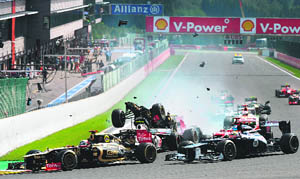 Lotus teams Romain Grosjean, Ferraris Fernando Alonso and McLaren Mercedess Lewis Hamilton crash at the start of the Belgian F1 Grand Prix on Sunday.