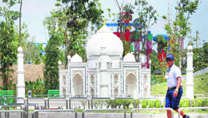 A staff member walks past a miniature model of the Taj Mahal made of Lego bricks during a preview at Legoland Malaysia. Legoland Malaysia is Asias first @@Legoland theme park and will open on September 15. 