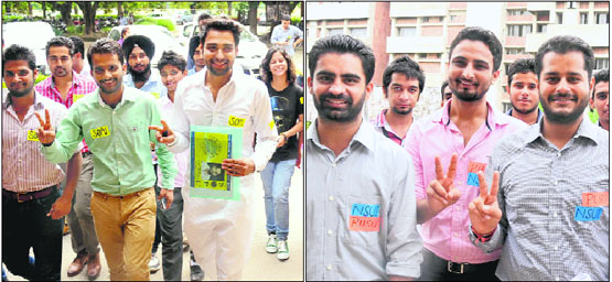 SOPU presidential candidate Satwinder (in white kurta pyjama); and (right) PUSU-NSUI presidential candidate Abhinav on their way to file the nomination papers at Panjab University in Chandigarh on Monday.